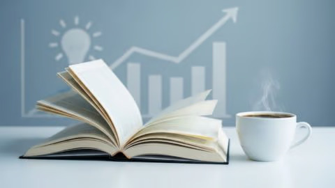 Livro-aberto-sobre-estratégias-de-empreendedorismo_-com-café-e-gráfico-de-crescimento